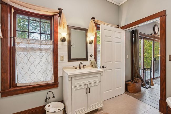 Here is the first look at the primary bedroom walkthrough ensuite. This room has been updated with a new vanity, toilet, and fresh paint. | Image 23
