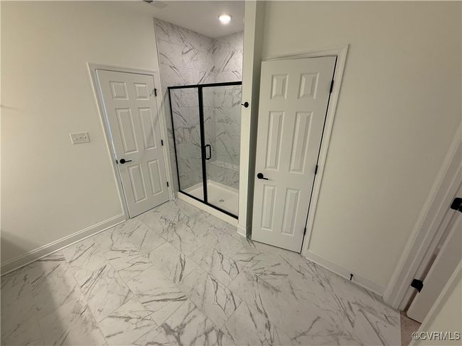 Bathroom with marble finish flooring, baseboards, a marble finish shower, and recessed lighting | Image 7