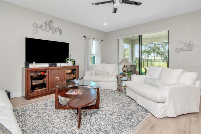 Living Room sliders beckon to the Lanai & Large Yard | Image 14