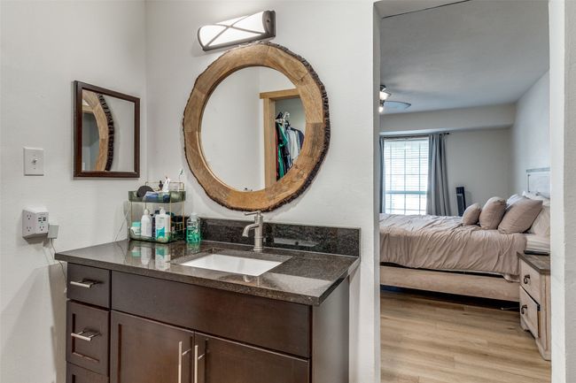 Bathroom featuring wood finished floors, connected bathroom, and vanity | Image 19