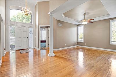 Foyer featuring a raised ceiling and light hardwood / wood-style flooring | Image 3