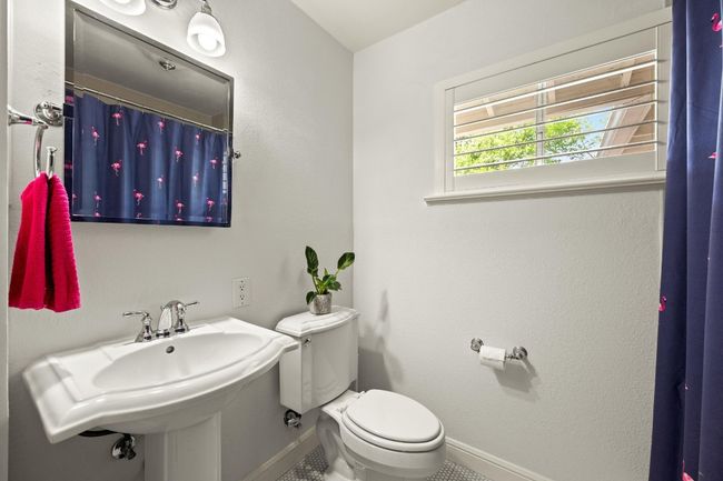 The bathroom offers a window for natural light while you're getting ready. | Image 15