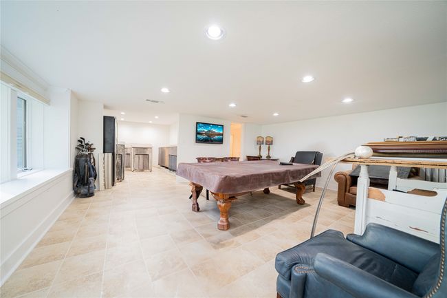 Recreation room with recessed lighting, pool table, and light tile patterned floors | Image 38