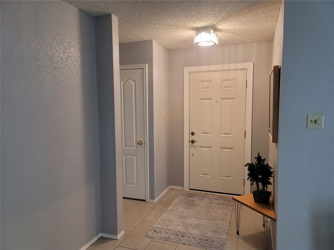 Entrance foyer featuring ceramic tile flooring | Image 12