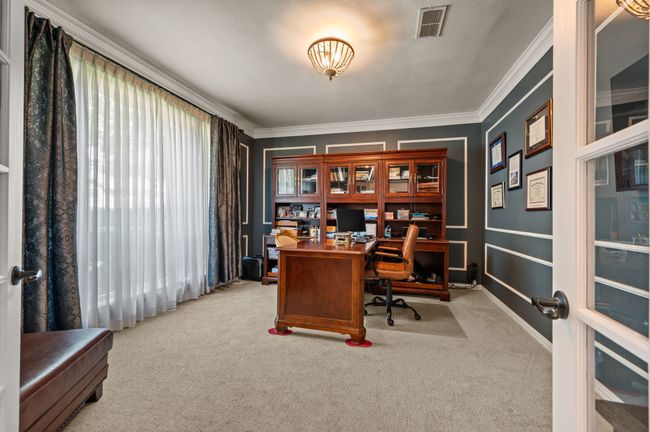 Home office with light colored carpet and crown molding | Image 6