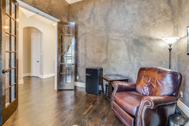 Living area featuring french doors, arched walkways, baseboards, and wood finished floors | Image 5