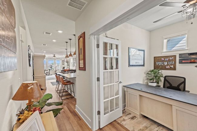 Hall with light wood finished floors, visible vents, and recessed lighting | Image 7