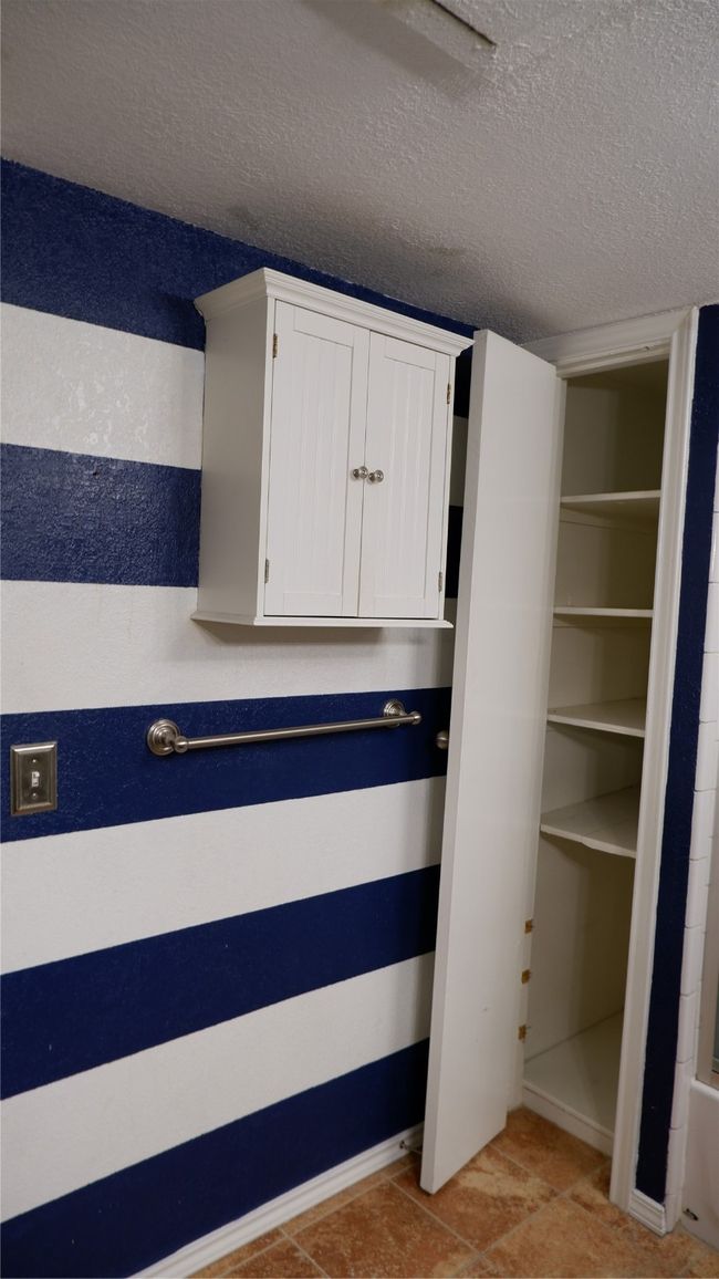 View of bathroom storage | Image 14