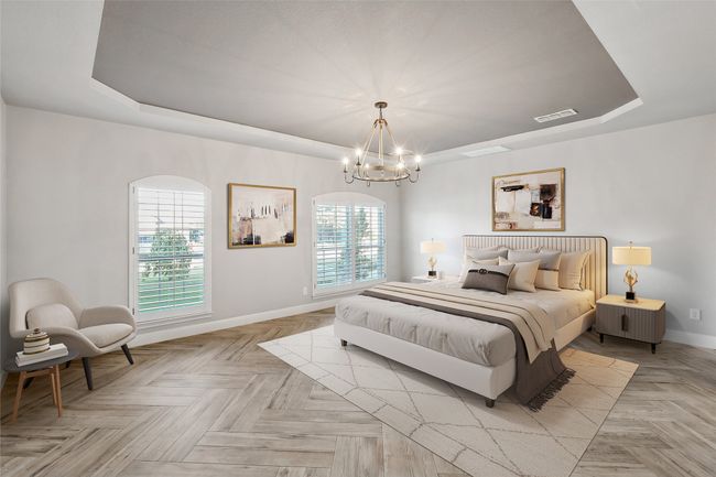 Bedroom with a raised ceiling, visible vents, baseboards, and an inviting chandelier | Image 7