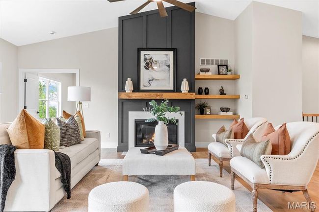 Custom gas fireplace with quartz surround and built-in shelving! | Image 24