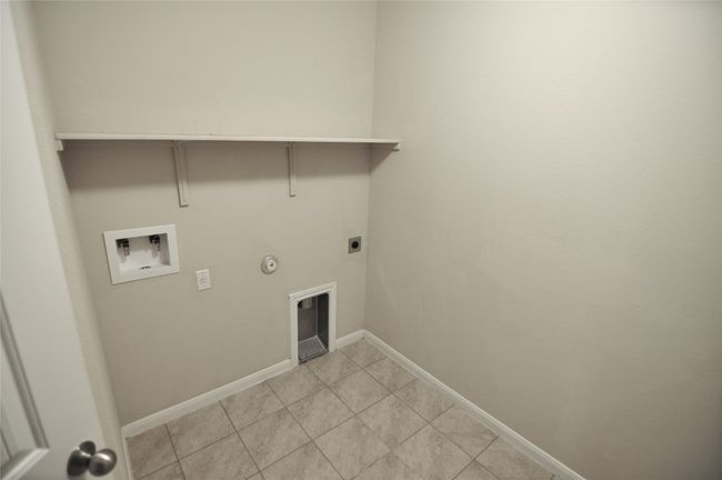 Laundry room featuring laundry area, electric dryer hookup, hookup for a washing machine, baseboards, and gas dryer hookup | Image 11