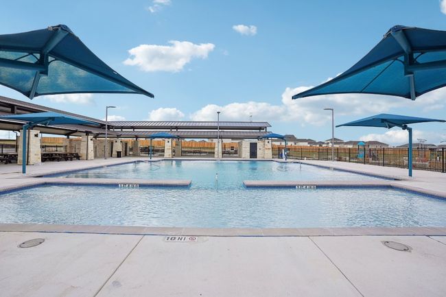 Community pool featuring fence and a patio | Image 20