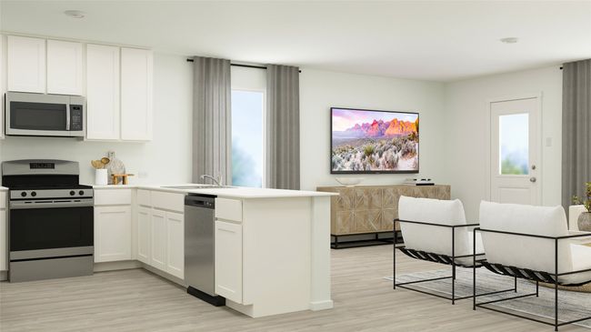 Kitchen featuring appliances with stainless steel finishes, a peninsula, light wood finished floors, and white cabinets | Image 22