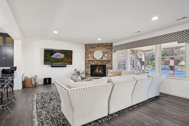 Family room with a gas fireplace for cozy winter evenings. | Image 61