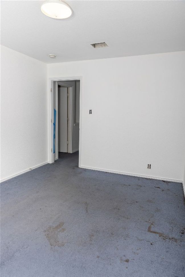 Unfurnished room featuring carpet and a smoke detector | Image 17