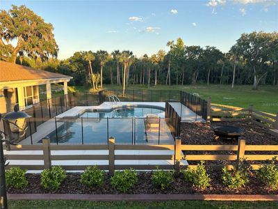 Swimming pool with stone fountain | Image 1