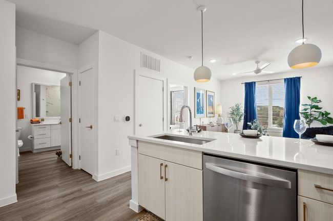 Kitchen features a breakfast bar and is open to family room.The ideal setup for daily living and entertaining. *Photos are of similar unit* | Image 9