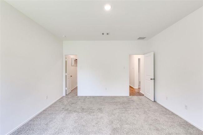 Empty room featuring light colored carpet and baseboards | Image 17