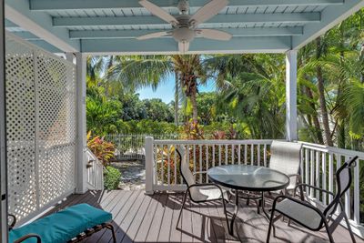 Porch overlooking private backyard | Image 1