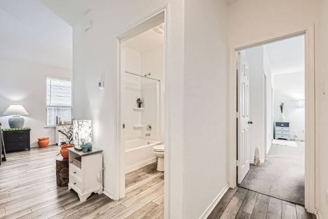 Hall with light wood finished floors and baseboards | Image 24