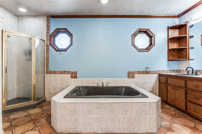 Full bath with a stall shower, vanity, a garden tub, ornamental molding, and recessed lighting | Image 27