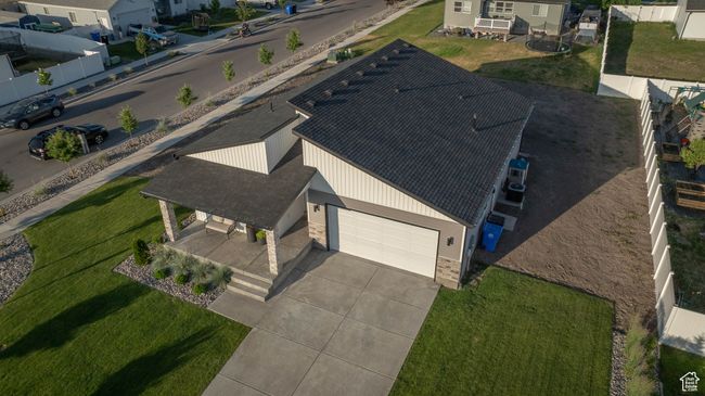 Get a stunning look at this modern home from above—partially fenced and perfectly situated in a newer neighborhood surrounded by natural beauty. Just minutes from outdoor adventures, parks, and trails! | Image 42