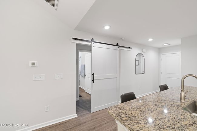 Barn door to close off hallway to guest rooms and bath. | Image 15