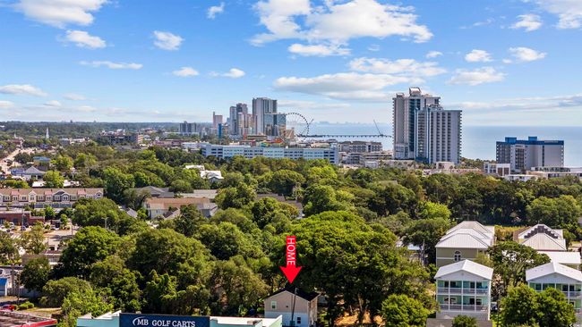 View of urban area featuring a tree filled landscape | Image 37