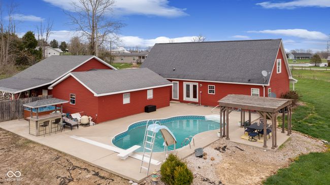 view of swimming pool with a gazebo, a fenced in pool, a patio, and outdoor dry bar | Image 45