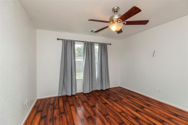 Primary Bedroom. Spacious and serene main bedroom perfect for rest and relaxation. | Image 10