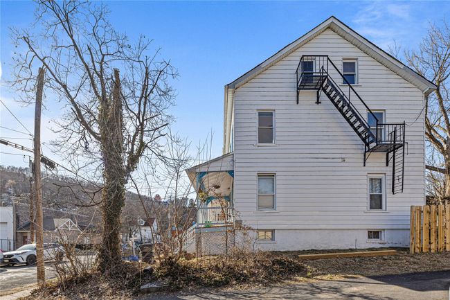 View of home's exterior featuring fence | Image 27