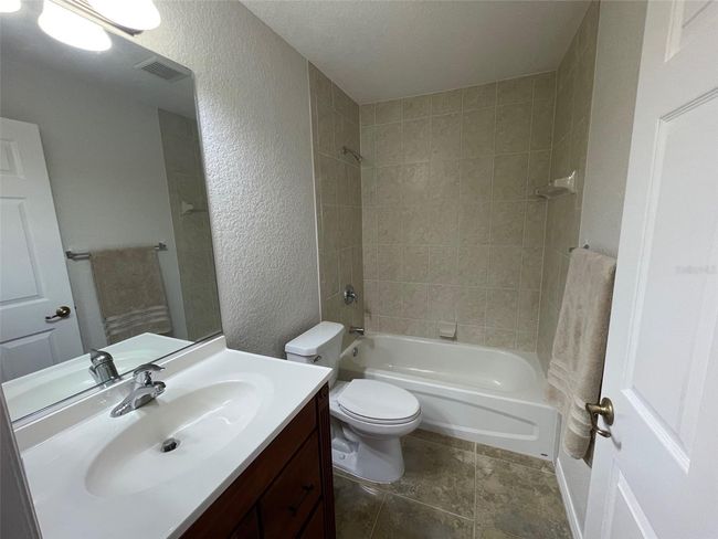Guest bath with linen closet outside the door | Image 22