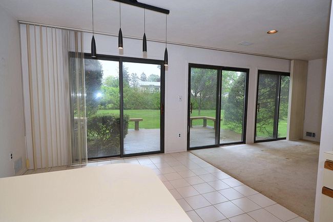 Entryway with tile patterned floors, visible vents, carpet, and recessed lighting | Image 4