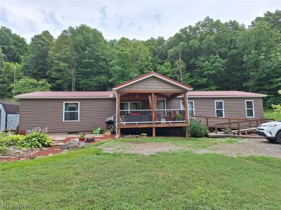 Front of home with inviting porch | Image 1