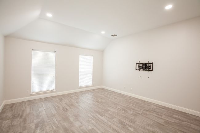 Empty room with recessed lighting, vaulted ceiling, and light wood finished floors | Image 40