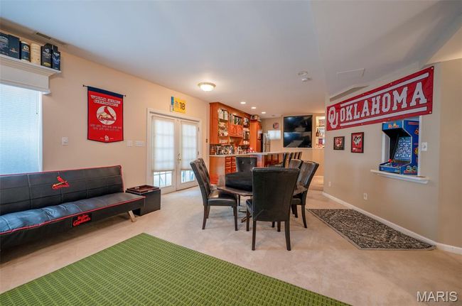 Dining space with light colored carpet, french doors, and recessed lighting | Image 40