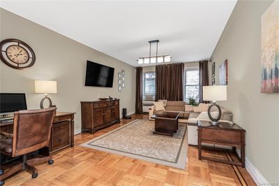 Living room featuring light parquet floors | Image 1