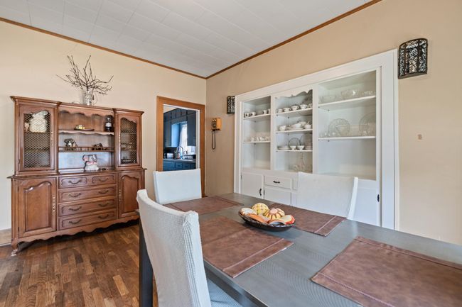 Dining room featuring crown molding and dark wood-style floors | Image 27