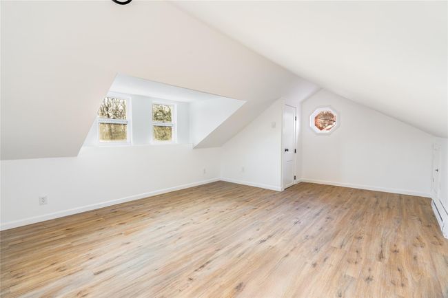 Bonus room with hardwood / wood-style floors, vaulted ceiling, and baseboards | Image 15