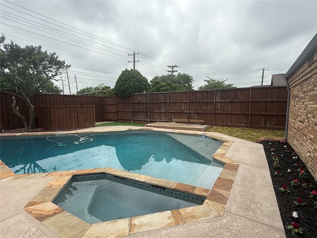 This home does have a grassy area so pets will have someplace to go. | Image 18