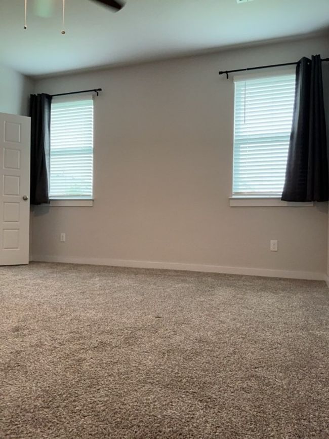 Primary room with plenty of natural light and carpet flooring | Image 14
