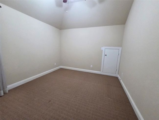Bonus room with lofted ceiling, ceiling fan, and carpet | Image 25
