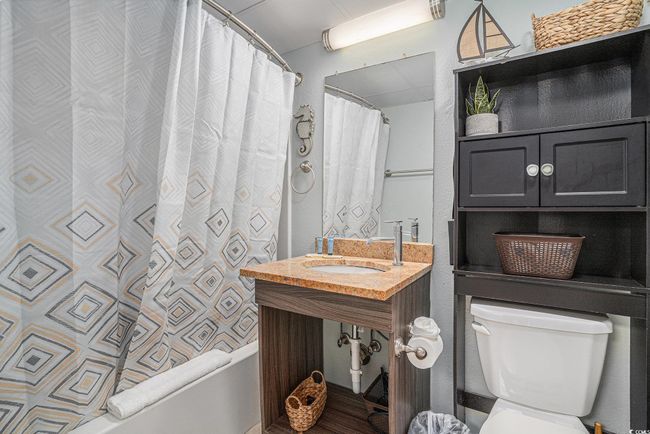 Full bath featuring shower / bath combo with shower curtain and vanity | Image 13