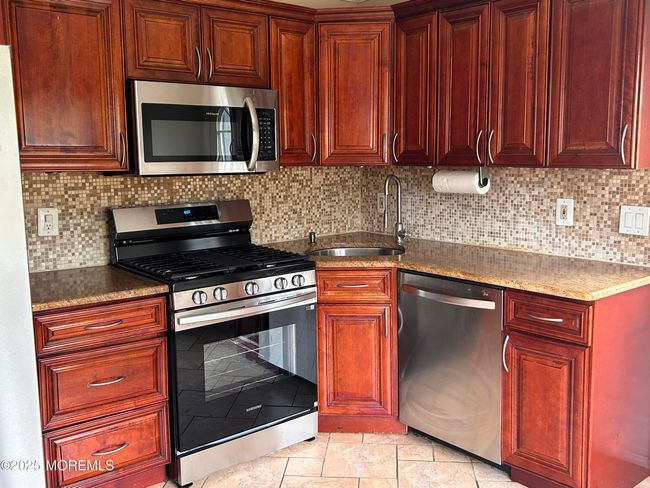 Microwave included. Refrigerator & Stove Purchased April 2025. | Image 5