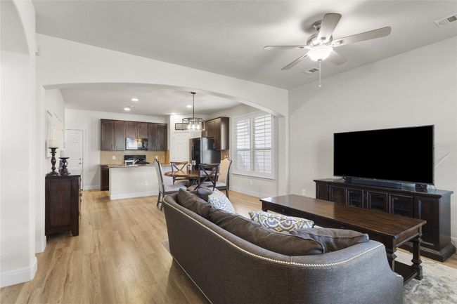 Welcome home to this bright/light condo without any carpet and new plantation shutters! | Image 4