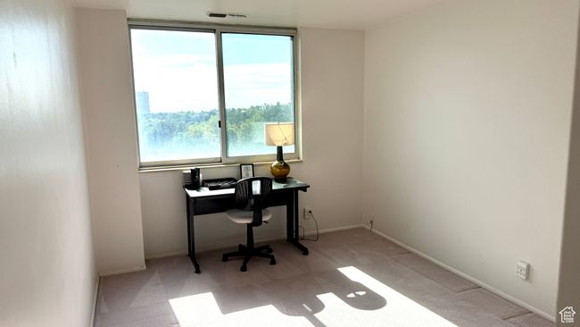 Carpeted office space with baseboards | Image 35