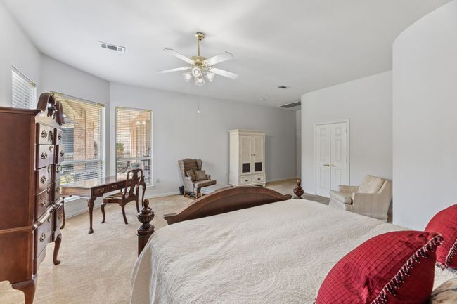 Bedroom with light colored carpet and ceiling fan | Image 28