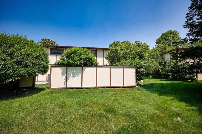 View of grassy back yard | Image 28