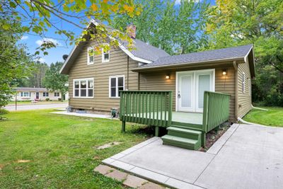 Concrete driveway and walk up to patio/kitchen door | Image 2