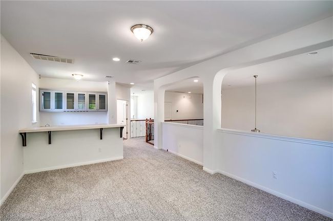 Unfurnished room with light colored carpet and recessed lighting | Image 22